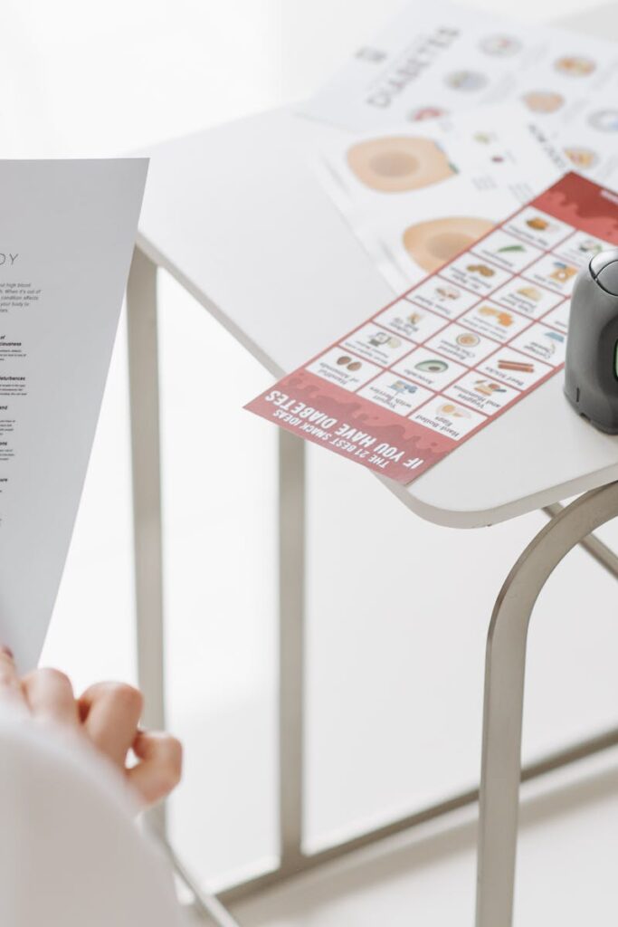Close-up of diabetes management tools and educational materials on a table.
